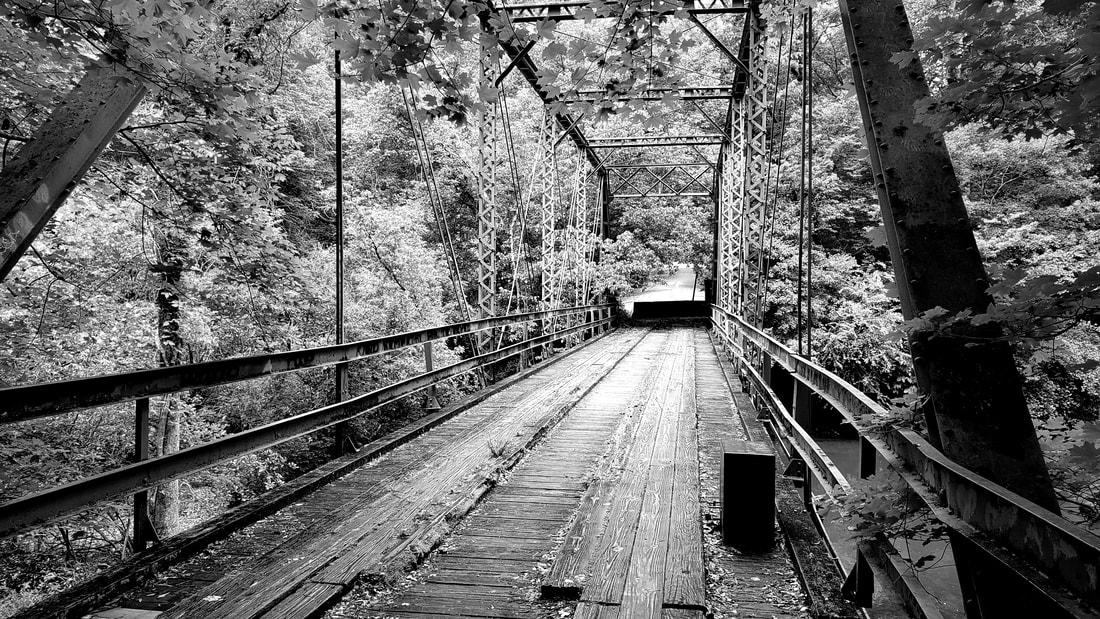 Old bridge in woods