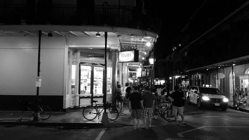 Crowd outside of corner convenience store, French Quarter, New Orleans